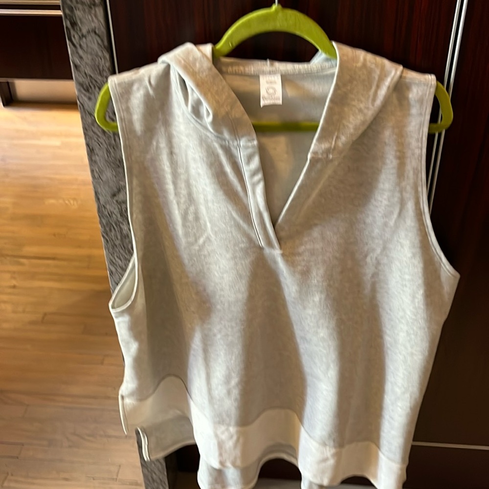 Casual top T-shirt fabric hoodie with longer back and slit sides. Never worn.